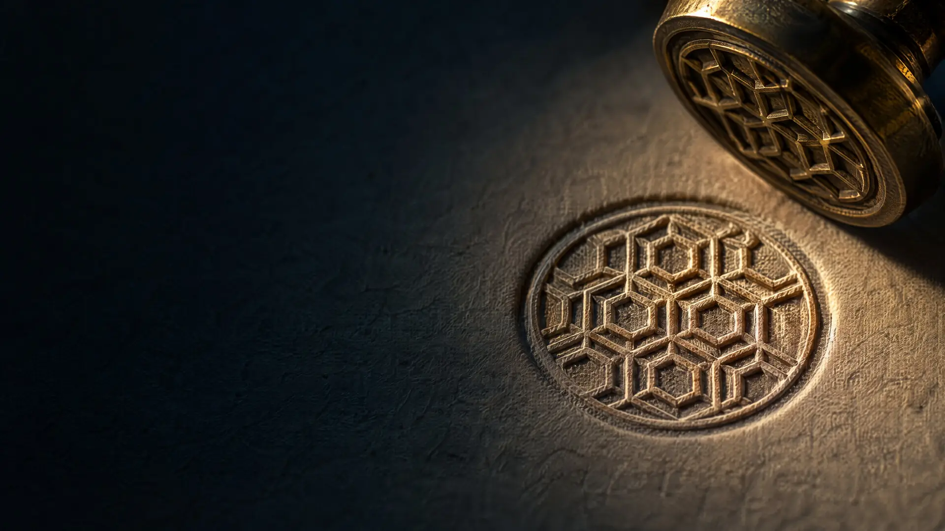 A brass seal pressed into thick paper
